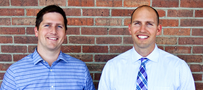 Headshots of Joel and Jordan Tampien of 4 Degrees Real Estate (AppFolio Property Manager customers).